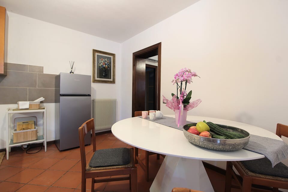Apartment, Patio, Garden View | Private kitchen | Fridge, espresso maker, highchair, cookware/dishes/utensils