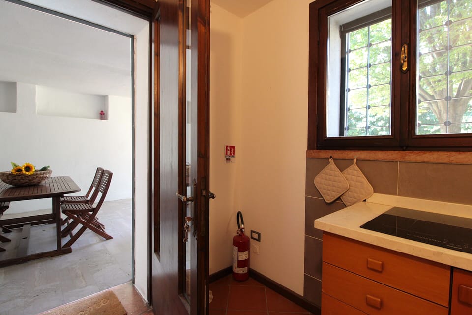 Apartment, Patio, Garden View | Private kitchen | Fridge, espresso maker, highchair, cookware/dishes/utensils
