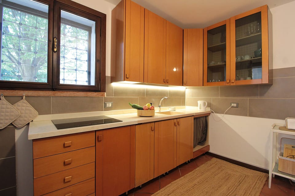 Apartment, Patio, Garden View | Private kitchen | Fridge, espresso maker, highchair, cookware/dishes/utensils