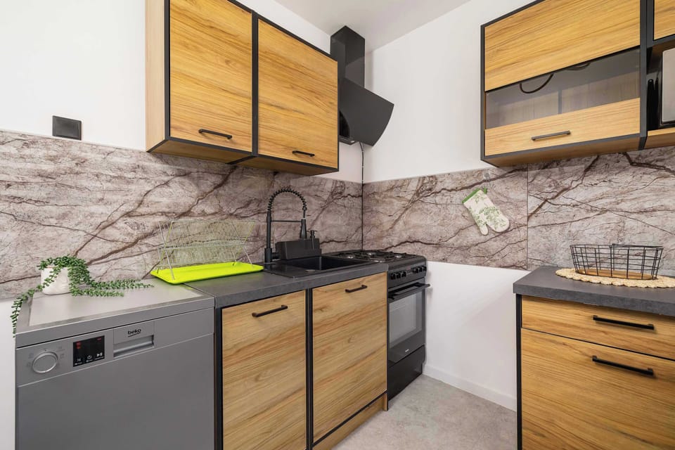 The kitchen's modern amenities ensure a comfortable stay.