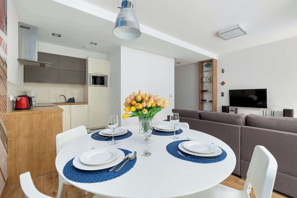 Large table with chairs for eating communal meals. 