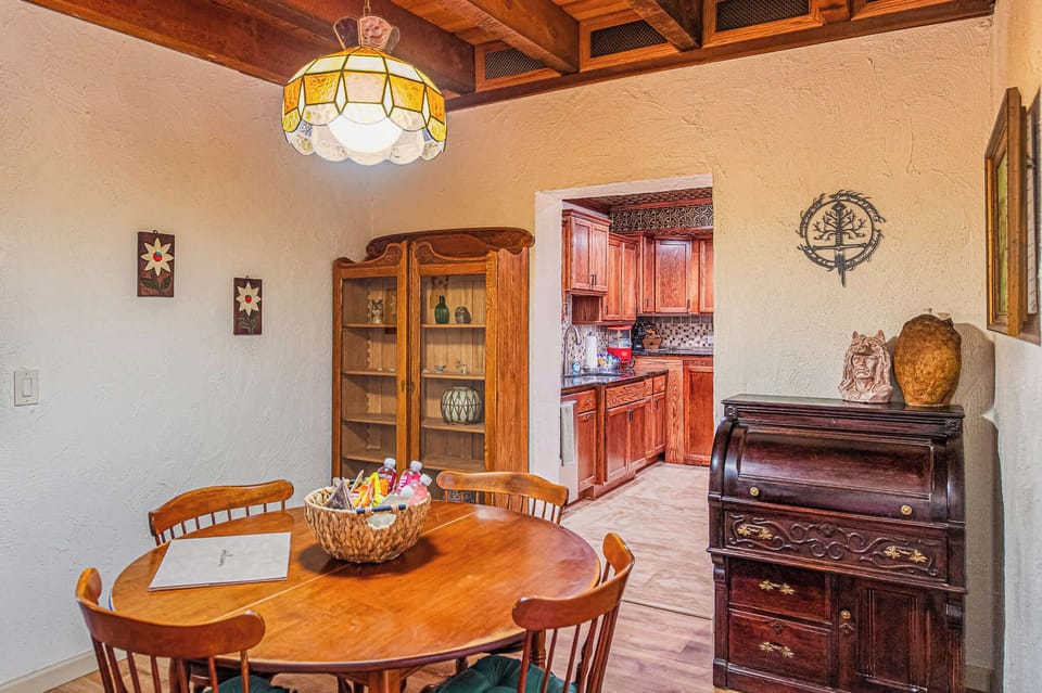 Gather around wood worn smooth by shared meals in dining table for 4.