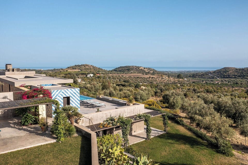 Views across the gardens and the rolling hills of the Val di Noto.