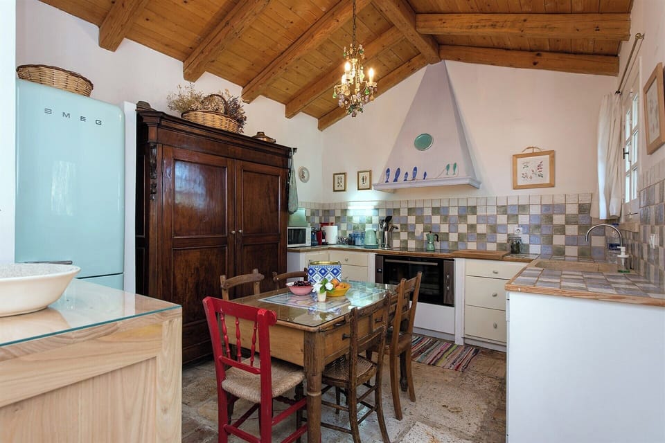 The well-equipped kitchen has outdoor access.