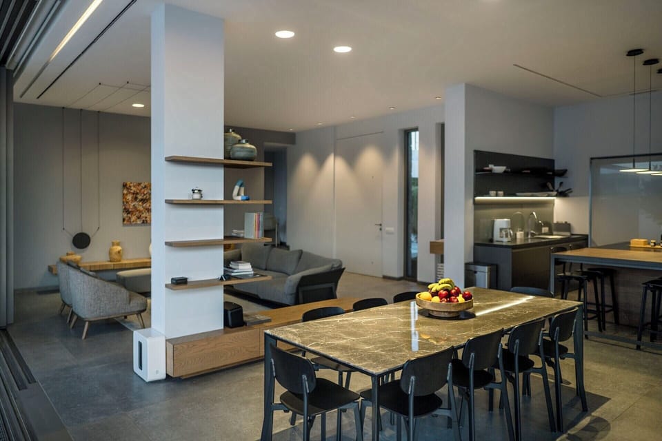 The dining area, with the kitchen visible behind.