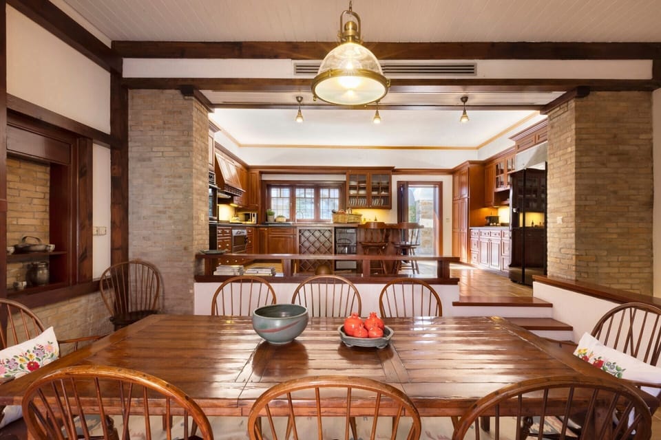 The breakfast table, down a few steps from the kitchen.