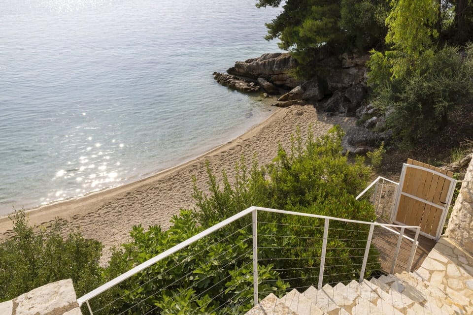 The magic gate, which opens onto the sandy beach below Eolia.