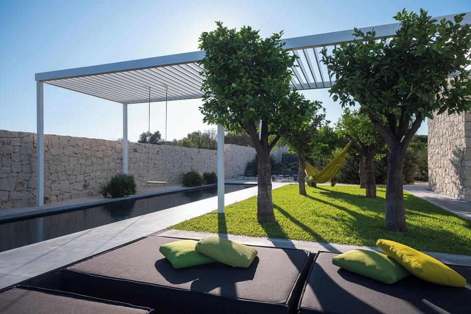 The graceful pool with its lounge area and swing.