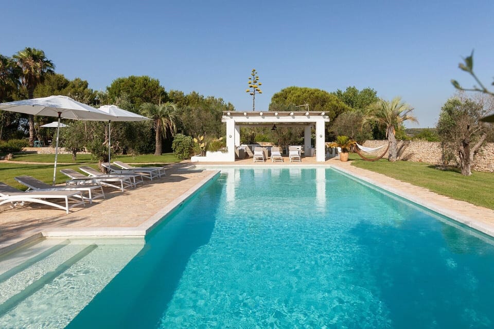 Loungers in the shade beside the pool awaiting you.