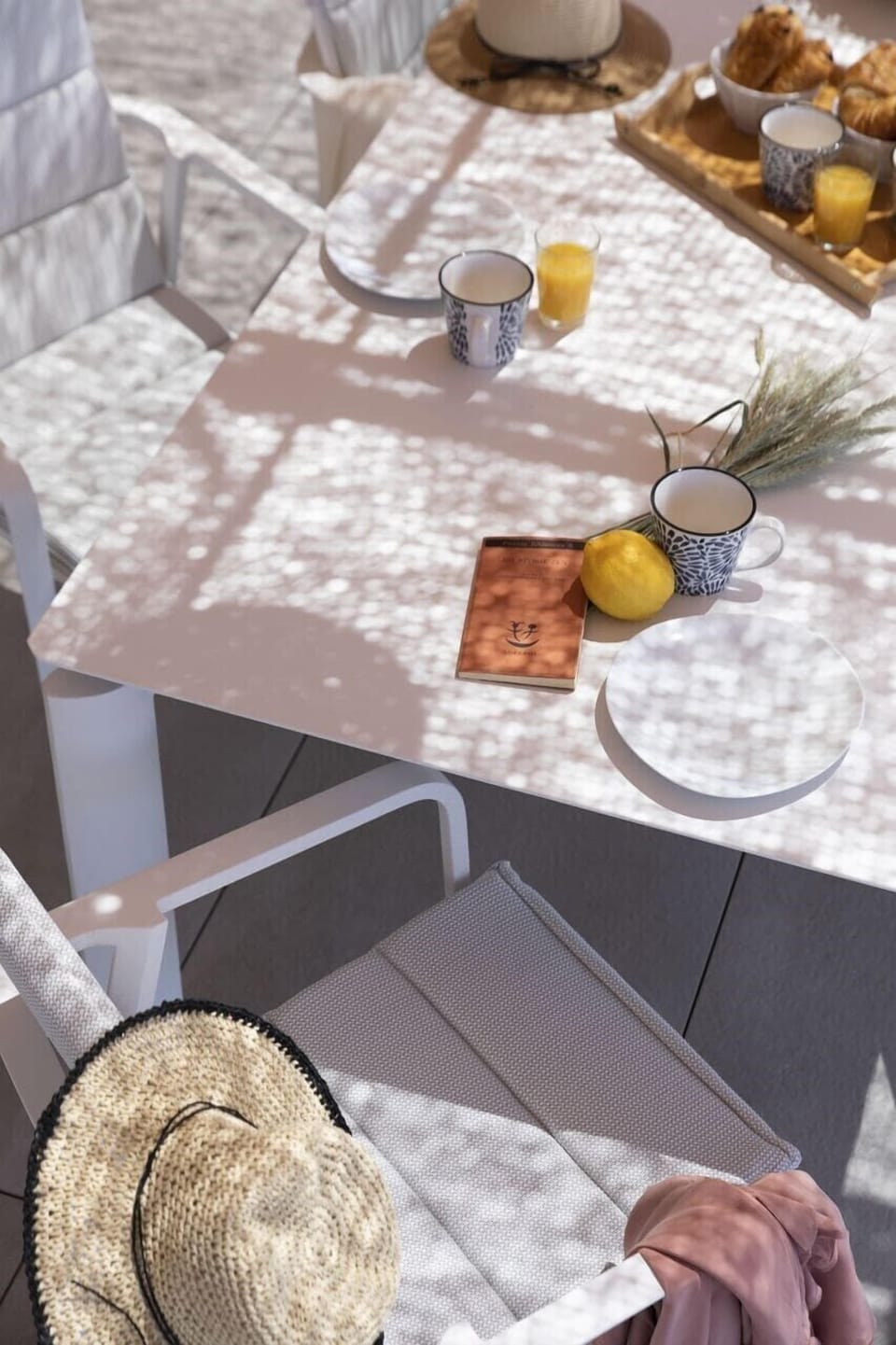 Making plans for the day over a glass of freshly squeezed orange juice and a croissant.