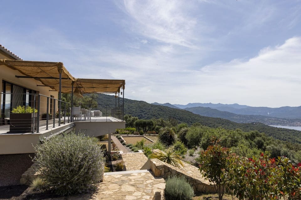 The main terrace runs along the entire façade of the house and round the sides too.