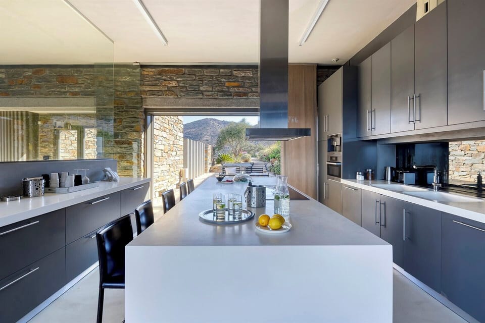 The sleek, fully equipped kitchen is a joy to cook in.