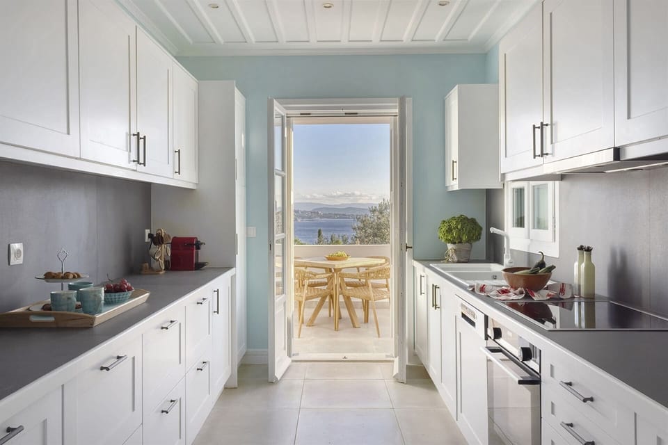 The well-equipped kitchen offers views out to sea and access to a delightful terrace.