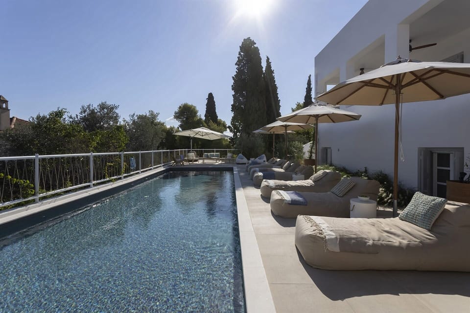 Relaxing by Catrine's enticing pool.