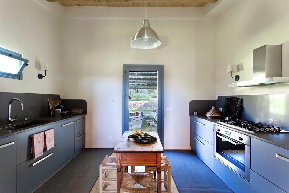 The large kitchen is well-equipped and designed.