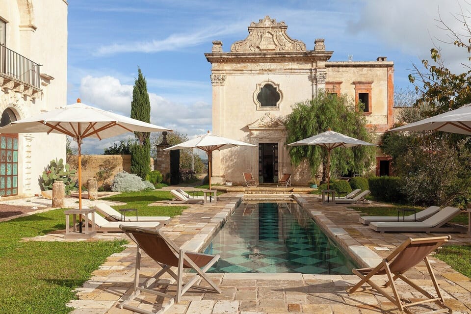 The handsome façade of the chapel benevolently gazing down at the pool. 