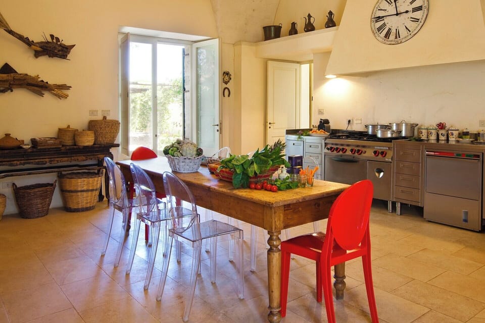 The huge kitchen also has a dining table.