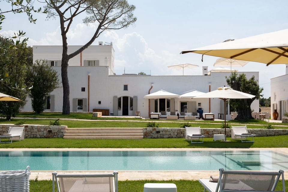 Verdant lawns, cerulean waters and the pristine white façade of Masseria Ciasca.