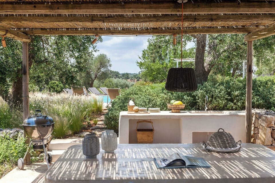 The shaded al fresco dining area near the pool.