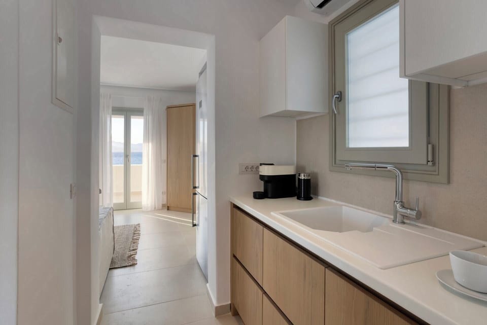 The upper floor's guest suite also has a kitchen area.
