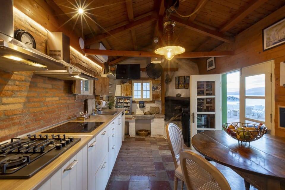 The large, well-equipped kitchen is in its own block just across the terrace. 