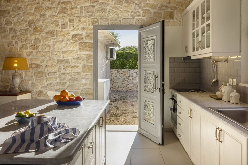 The kitchen opens out onto the surrounding terraces.
