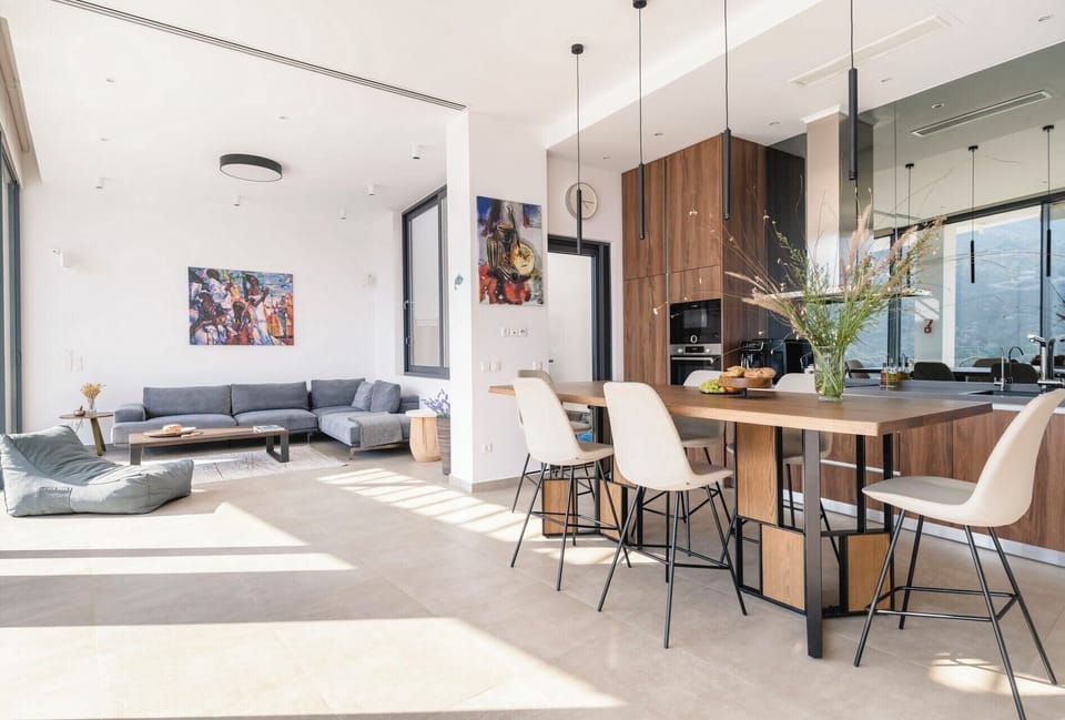 The open-concept dining-kitchen and living area.