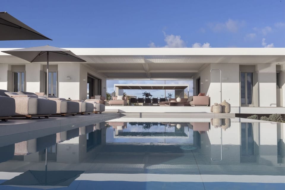 The two wings and central, communal terrace of Amira seen from the splendid pool.