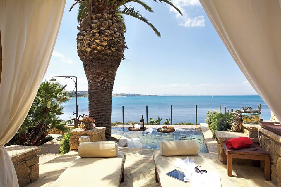 Azzurra's furnished sea-view terrace and plunge pool.