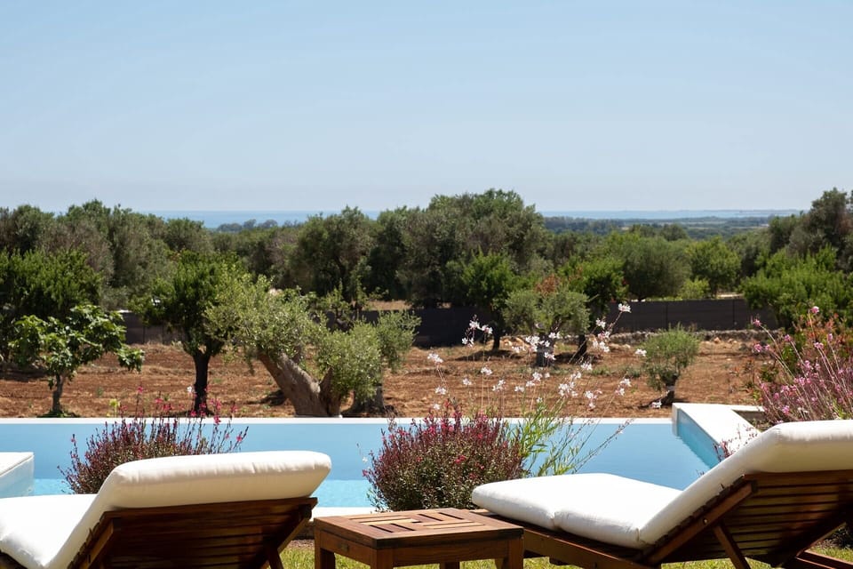 Choose your spot by the pool and soak up those views.