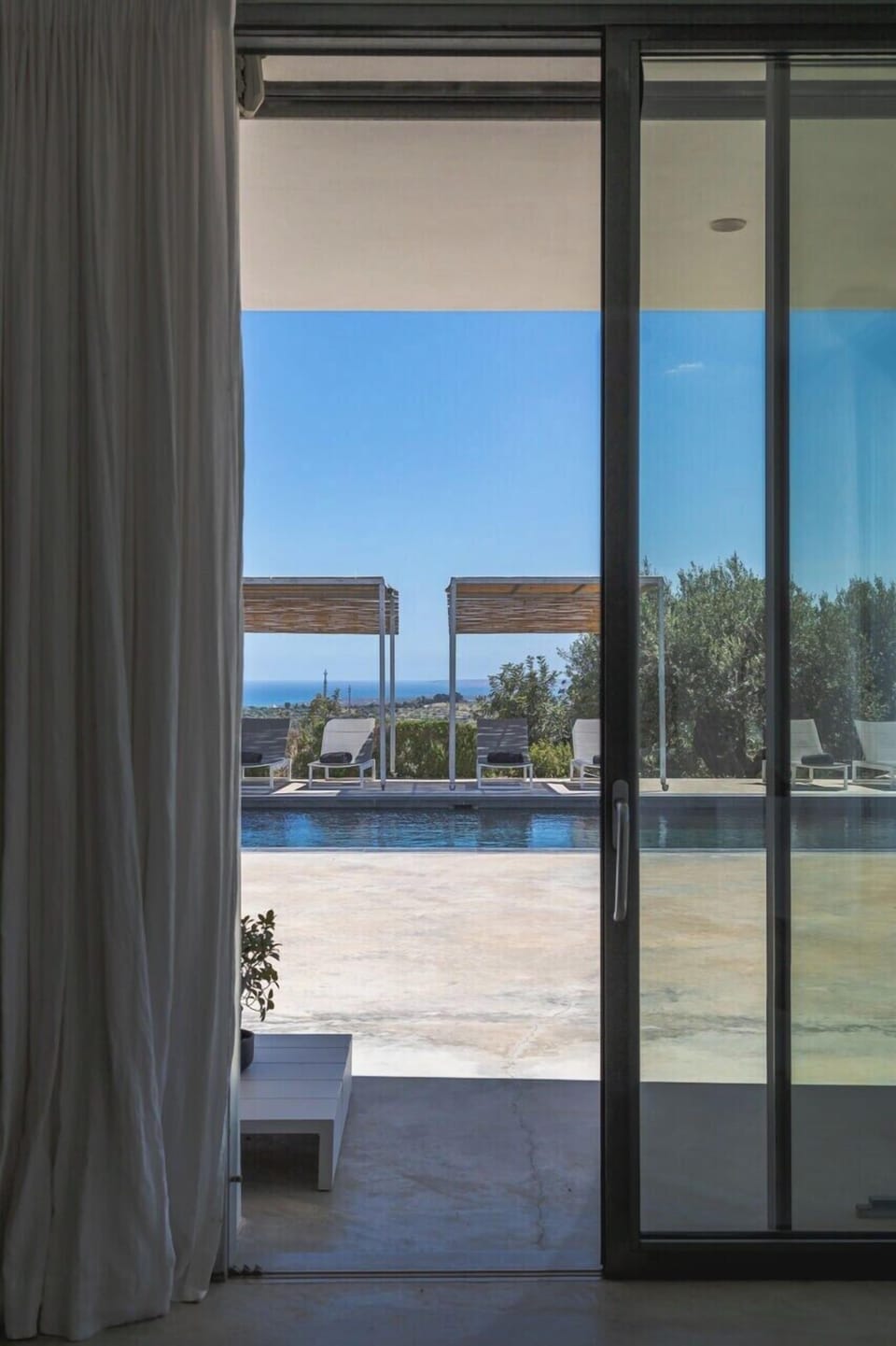 Looking out to the pool from the main indoor living area.