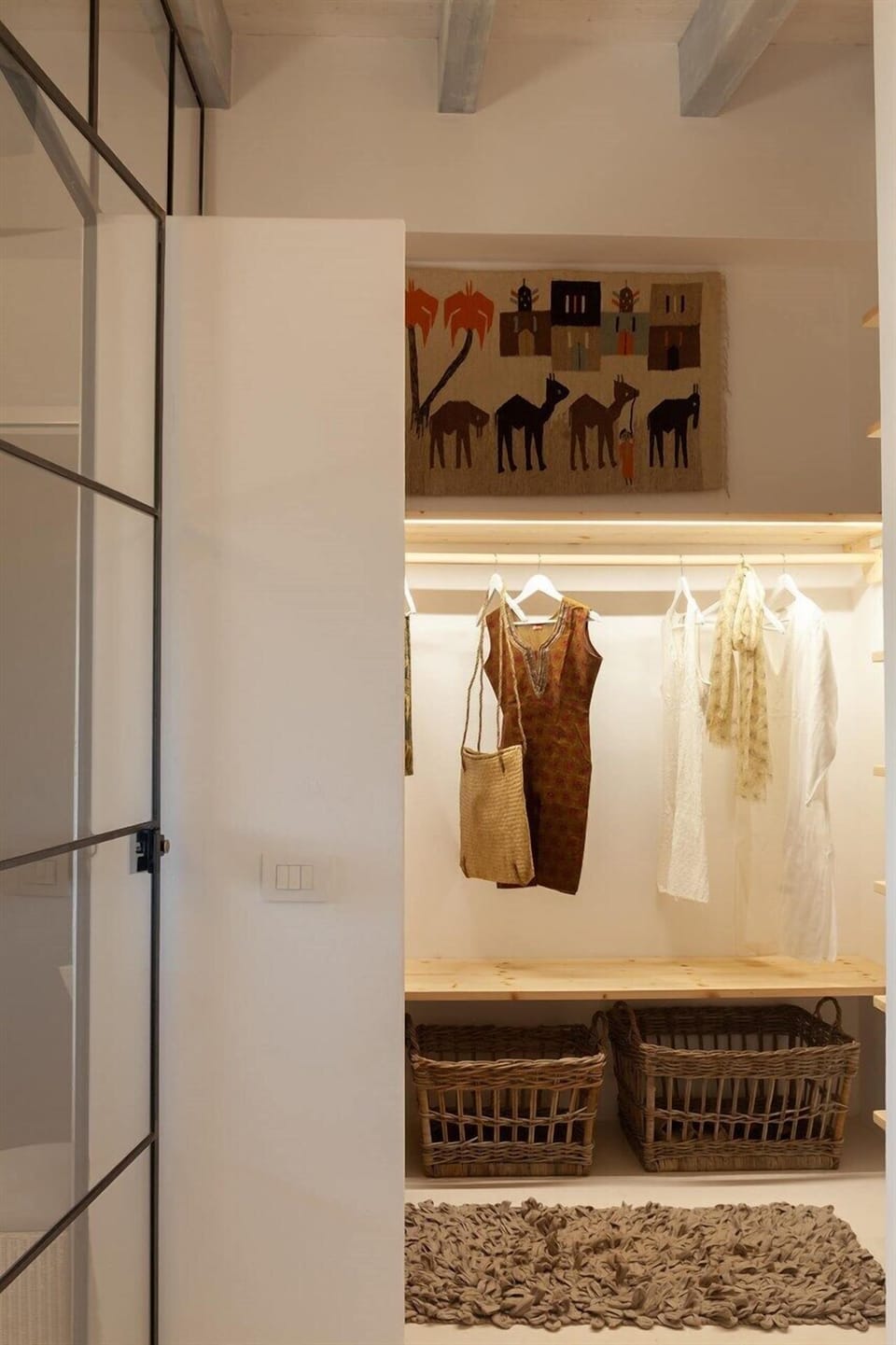 Its walk-through dressing room seen from the shower room.