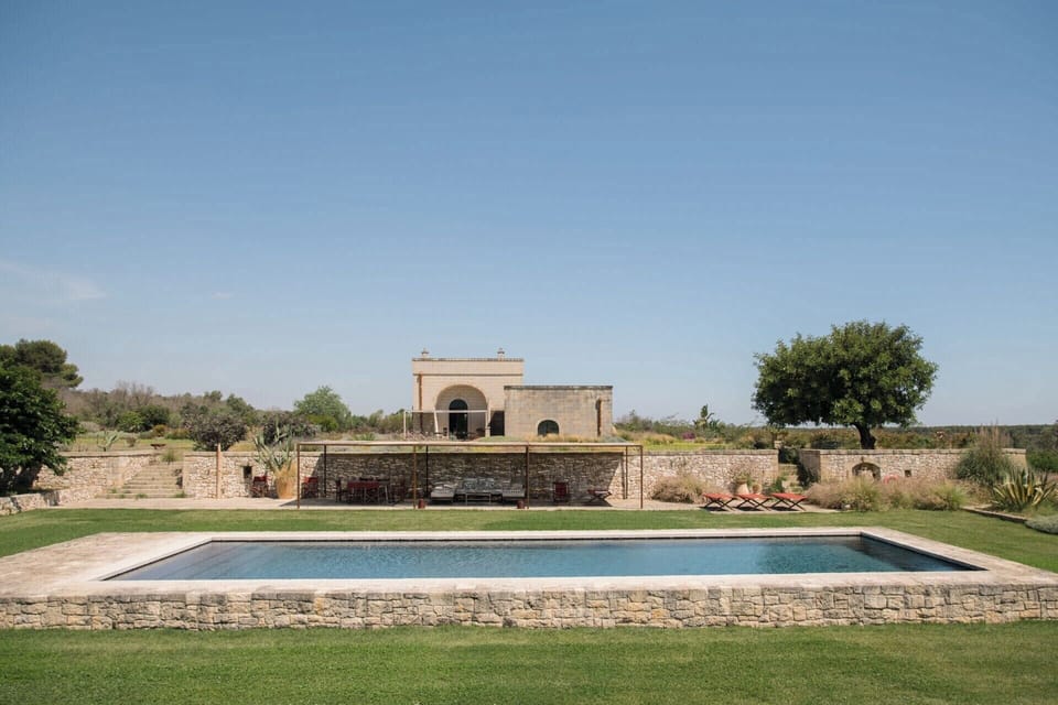 The pool with the house rising above.