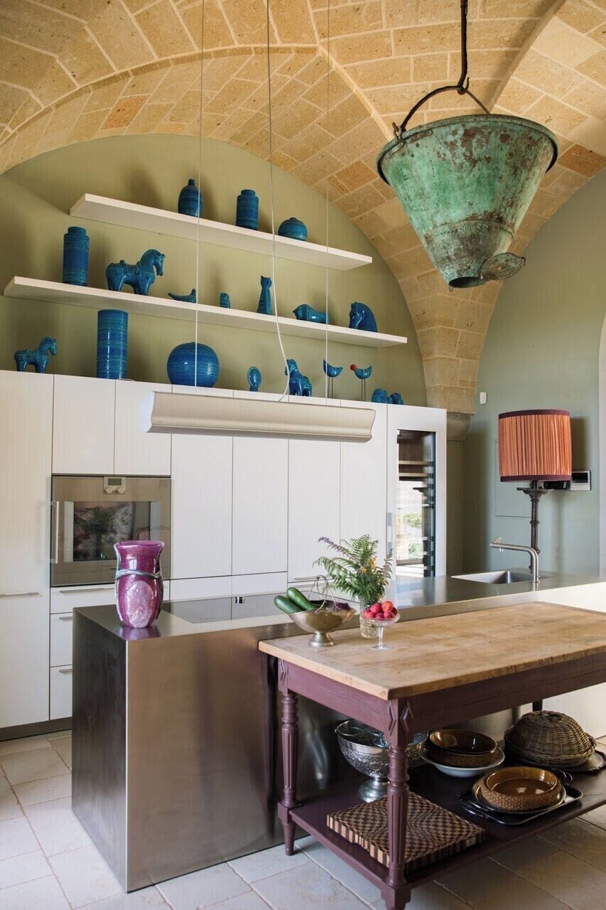 The contemporary kitchen with its stainless steel island.