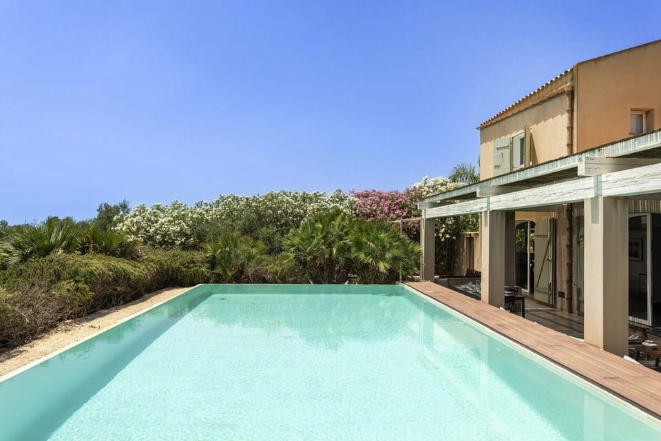 The inviting pool and house.