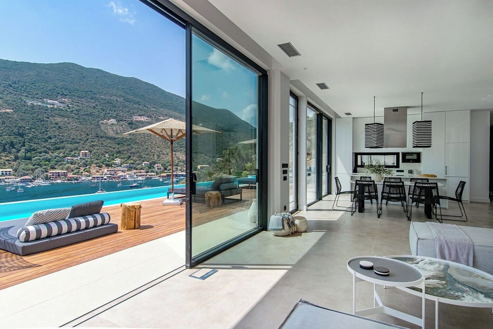 The spacious open-concept communal space with its wall-to-wall sliding glass doors.