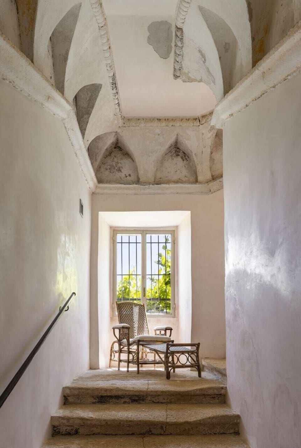 A time-worn stone staircase  leads to the upper levels of the masseria.