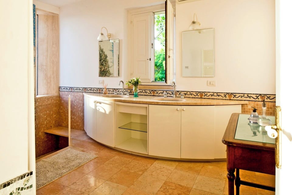 The bathroom next door to the third bedroom with its sunken bath. 