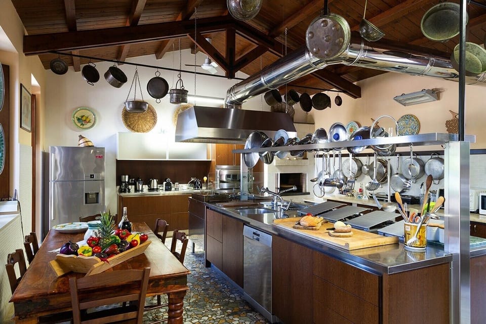 The kitchen is very large and professionally equipped. 