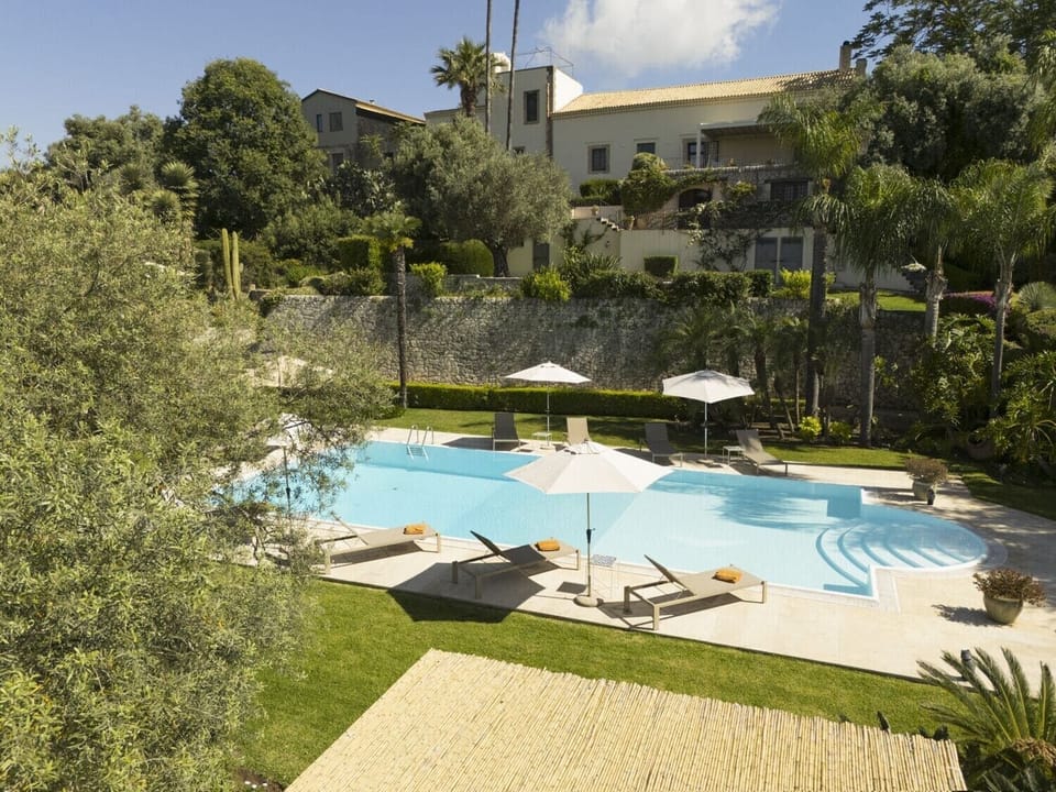 The stunning pool, hanging gardens and villa...
