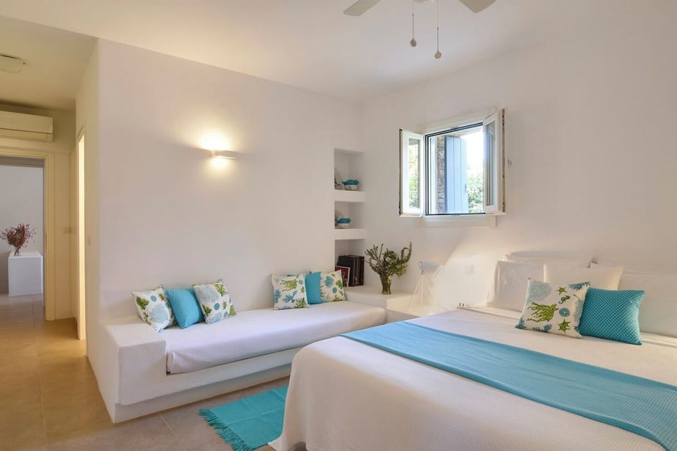 The second double-twin bedroom on the lower ground floor of the first house (bedroom 4).