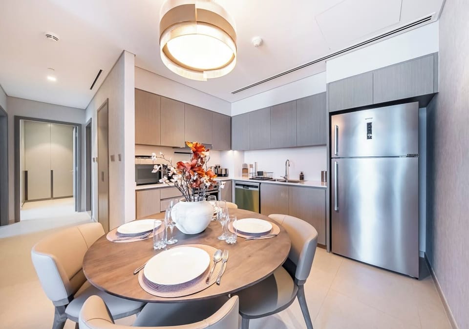 Fully equipped, modern kitchen flows into the elegant dining space.