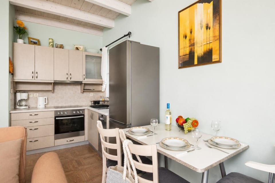 Open-plan living room with sofas, dining area, kitchen, A/C, WiFi internet, satellite TV, and sea views