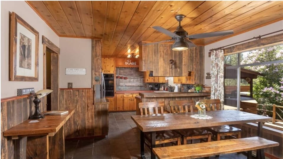 Dining Table, Bar Seating, plus Door to Back Deck