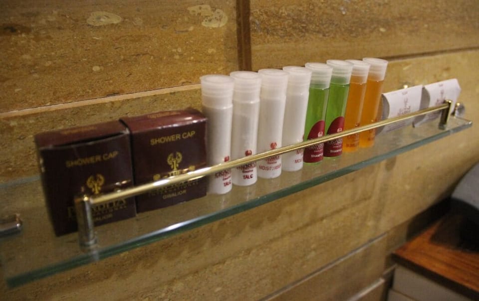 Bathtub, towels, soap, shampoo
