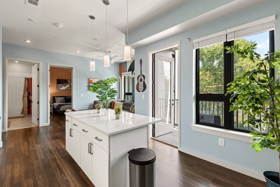 Lots of natural light pouring into this fully equipped kitchen. Seating for two at the island. Private balcony located off of the kitchen.