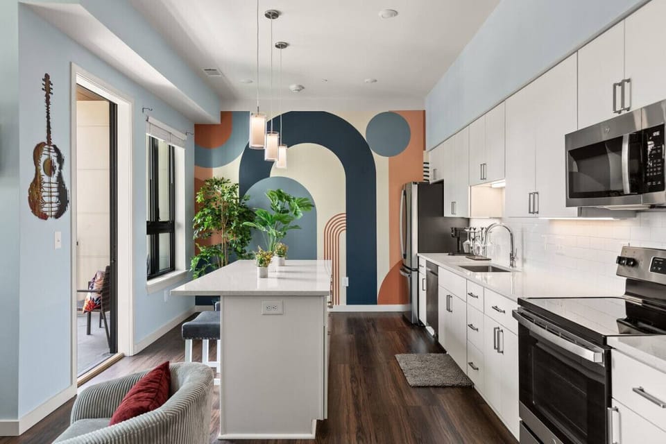 Lots of natural light pouring into this fully equipped kitchen. Seating for two at the island. Private balcony located off of the kitchen.