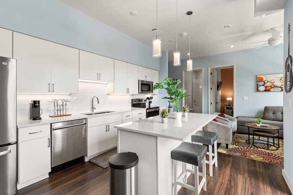 Lots of natural light pouring into this fully equipped kitchen. Seating for two at the island. Private balcony located off of the kitchen.
