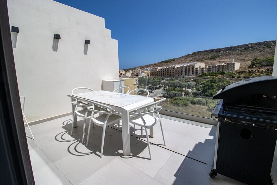 Grill, dine, and relax with beautiful views from this spacious rooftop terrace.
