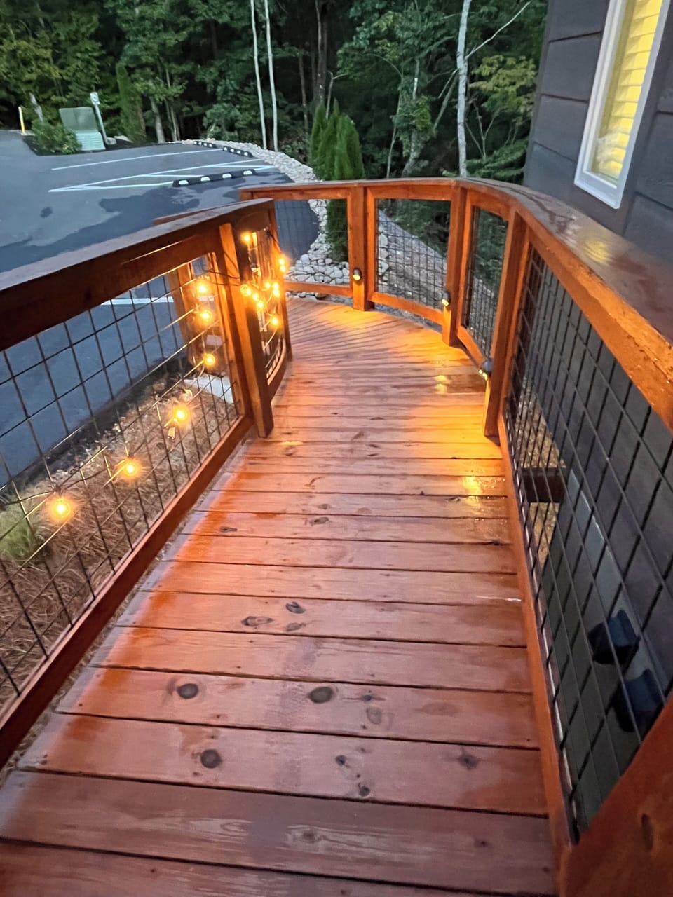 Lit pathway to the parking area just outside of the front door. 